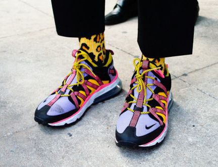 Street Style - person wearing black blue and yellow nike sneakers