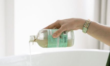 Skincare - Person Pouring Aromatic Soap On Water